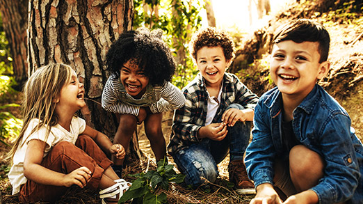 a group of kids happily outdoors