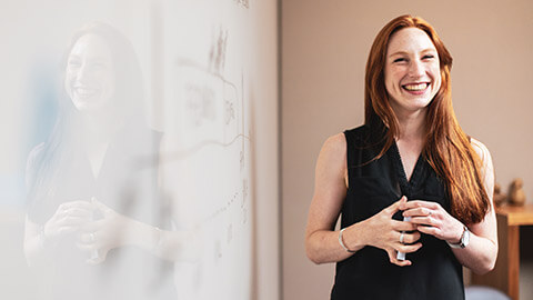 A childcare worker smiling and portraying positive communication skills