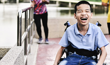 A child with disability laughing and having fun