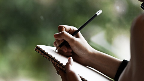 A person taking notes