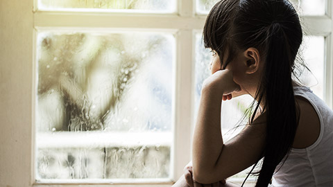 A child looking through the window