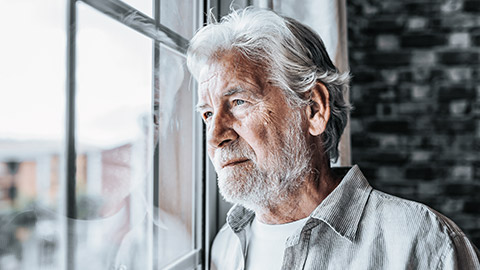 Senior looking out the window