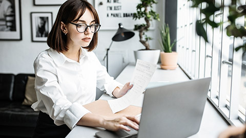 looking at documents and computer