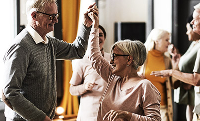 A GROUP OF ELDERS DANCING