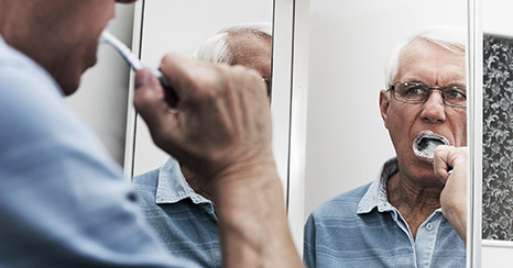 A person brushing their teeth