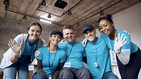 Team of happy diverse volunteers