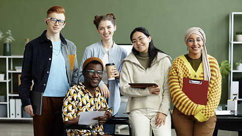 Diverse creative team looking at camera