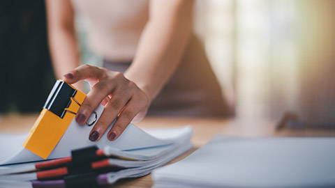 woman arranging documents and records