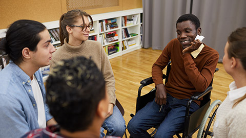 Multi-ethnic group of people sitting in circle