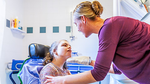 A carer working with a disabled client