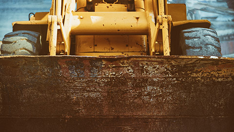 A close view of a front end loader on a building site