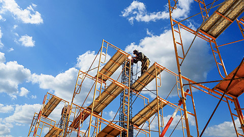 High risk construction work, Welder working on scaffolding