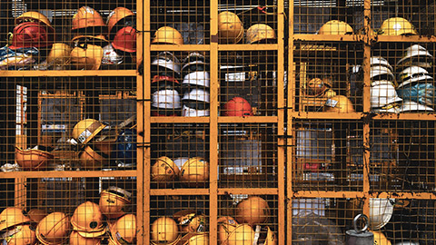 A wide view of a storage area for construction workers helmets