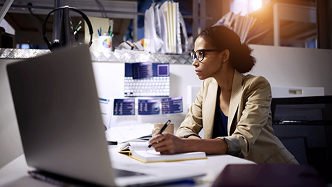 woman writing on notebook