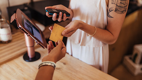 A close view of a customer paying for an item purchased from a small business