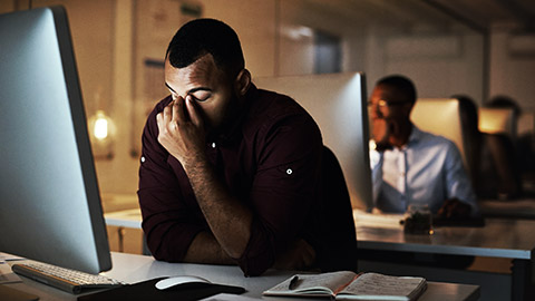 A close view of an accountant using a laptop