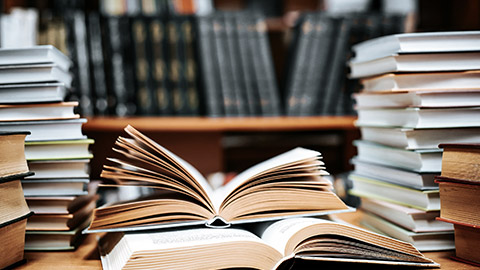 pile of books in the library