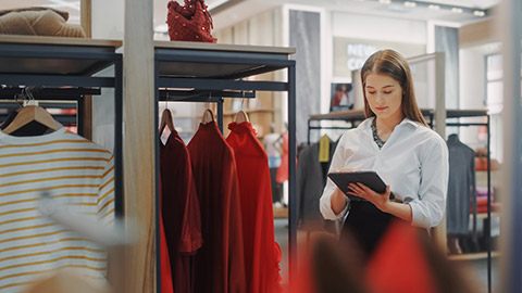 A business owner checking stock in a store