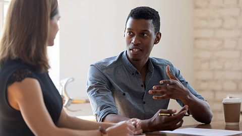 employee sharing problem solution ideas with skilled female colleague