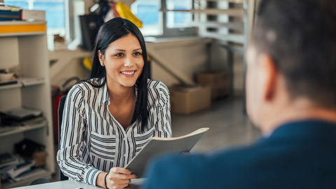 Woman consultant talking with client in office