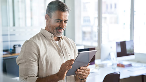 A person reading information on a tablet device