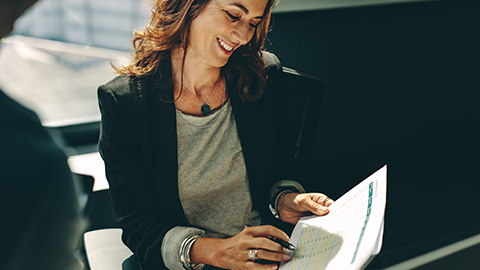 A person reading information in an office