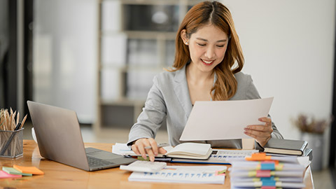 Asian business woman Working at the office, happy working day smile