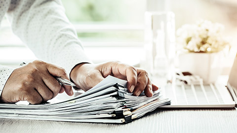 hands sorting paper