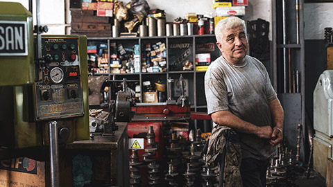 A sole trader standing in his workshop