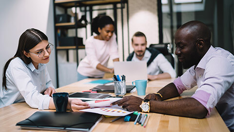 A work meeting between colleagues to discuss the business plan