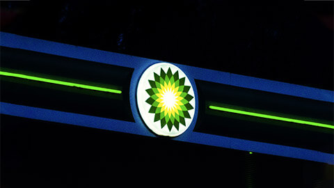 A close view of BP's logo at night