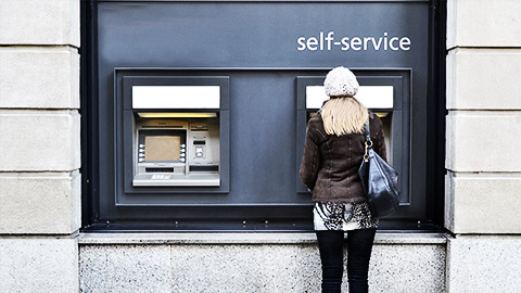 a person using an atm