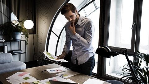 A person doing a qmp activity on a desk