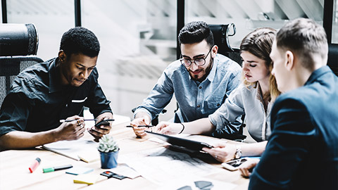 A group of people preparing a social media action plan