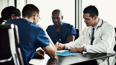 A group meeting of medical professionals having a decision making