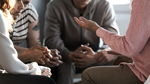 A group discussing accountability from conflict