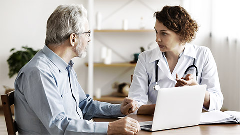 A medical person attending to a client with a complaint