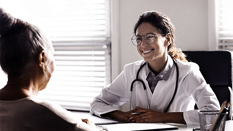 A practitioner talking to a patient