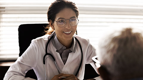 A medical professional talking to a client