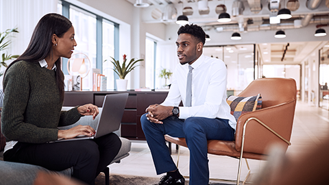 businesswoman interviewing a male candidate