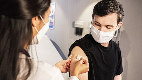 a person getting vaccinate by a professional