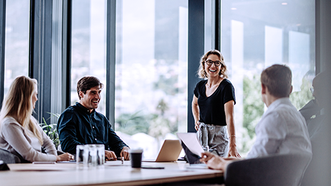 Office colleagues having casual discussion during meeting in conference room