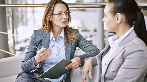 business woman talking to a colleague