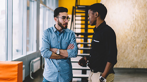 2 coworkers discussing a sensitive subject in an office environement