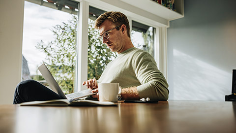 Man thoughtful, working at the computer