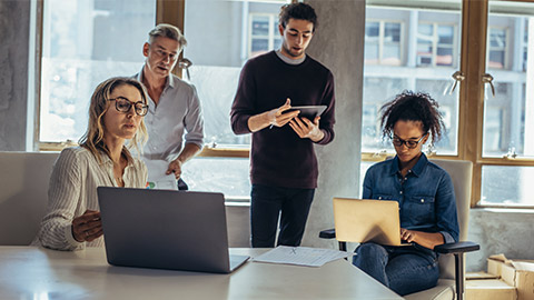 Multi-ethnic business people working together in the office.