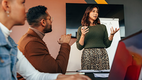 Female manager giving a presentation in a boardroom