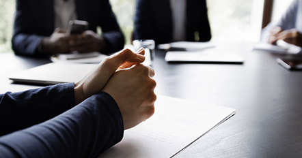 A group of lawyers in a company discussing legal ramifications in a presentation