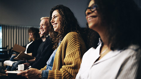 An engaged audience listening to a presentation