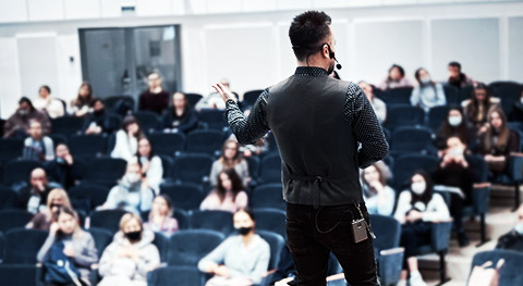 A speaker engaging their audience